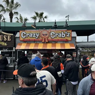 a crowd of people standing in line