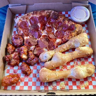 Two one-topping pizza slices, 3 buttery breadsticks, boneless bites, dip and one can soda or water for $7.99+ tax
