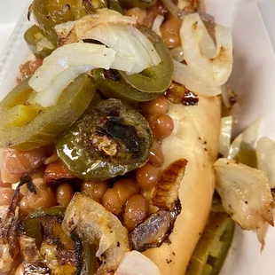 a hot dog with various toppings