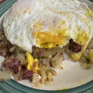 Homemade corned beef hash (one bite taken).