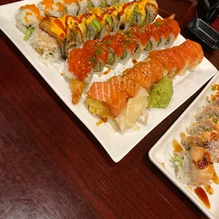 two plates of sushi on a table
