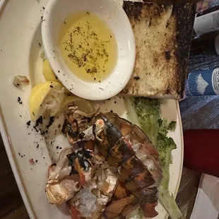Charred lobster that was decent, burnt toast, and the worst broccoli ever.