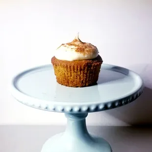 a cupcake on a cake stand