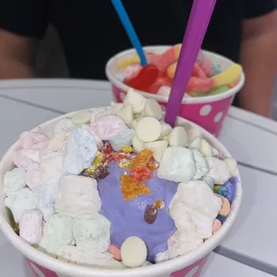 two cups of ice cream with marshmallows and marshmallows