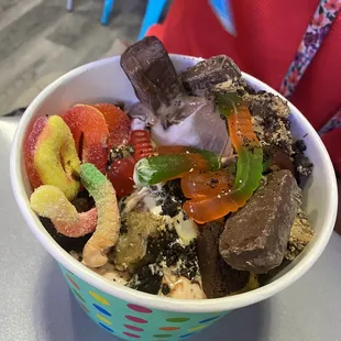 a person holding a bowl of ice cream