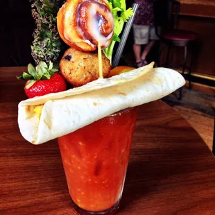 Sunday Funday. Breakfast Bloody Mary w/ breakfast burrito, blueberry muffin, cinnamon bun, strawberry, orange, and veggies.