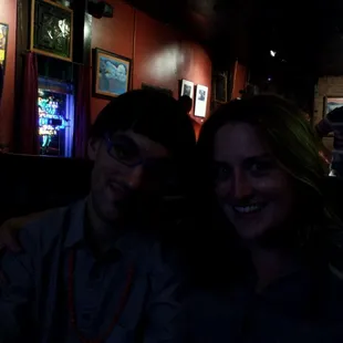 a man and a woman smiling for the camera