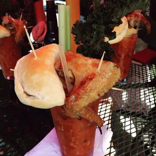 Today's Bloody Mary includes beef and cheese empanada, jerk chicken, and a mango habañero cheese and pineapple skewer.