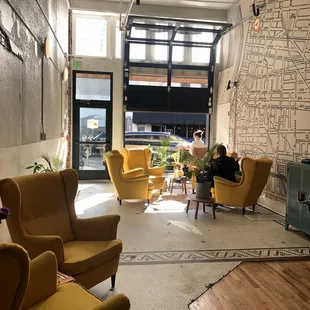 a man sitting in a yellow chair