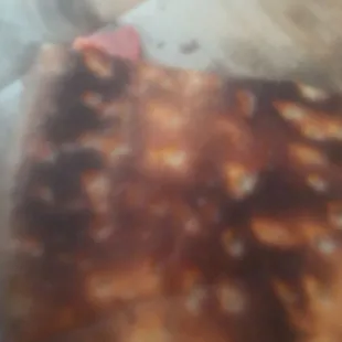 a close up of a piece of pizza