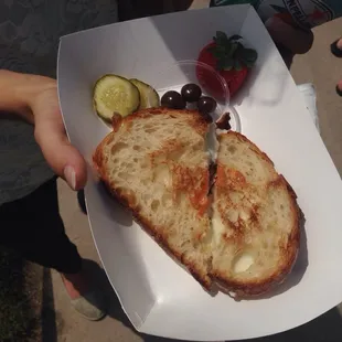 Grilled cheese with brie, goat cheese, bacon and sun dried tomato on sour dough. AMAZING.