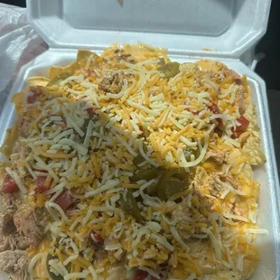 Chicken nachos with no pico de gallo very good and flavorful and big you get you money worth