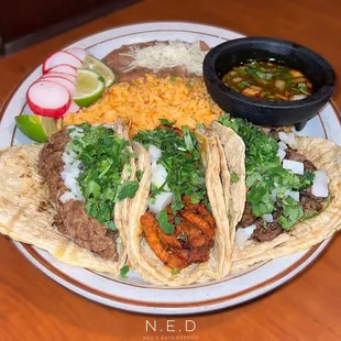 Al Pastor, Birria, and Carne Asada Tacos with Consommé, Beans, and Rice