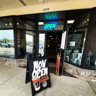 Front door and open sign at Peters township store.