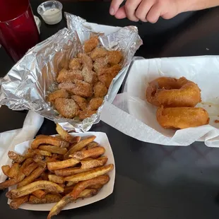 Fries, garlic parm chicken chunks, and onion rings