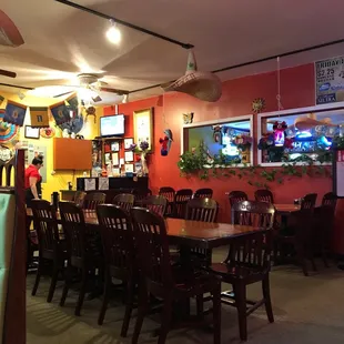 tables and chairs in a brightly lit restaurant