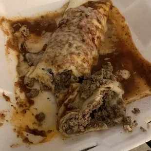 a burrito in a styrofoam container