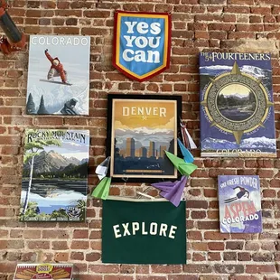 a brick wall with posters on it