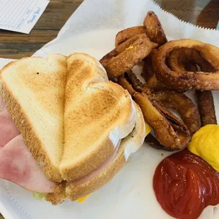 The club sandwich  with overcooked onion rings