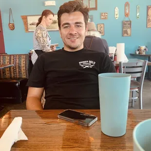 My son and the very sweet waitress in the background