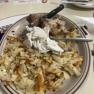 Undercooked hash browns and overcooked pork chops