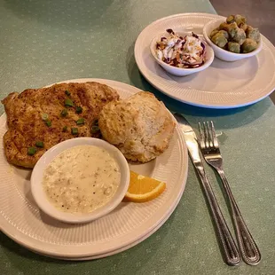The Southern House special at Crazy Pig. Pork, biscuit, gravy. Sides are Cajun slaw and fried okra.