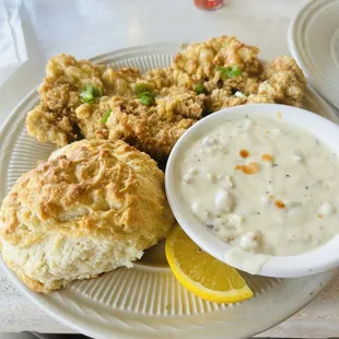 Fried pork chop with biscuit and gravy