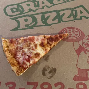 a slice of pizza on a pizza box
