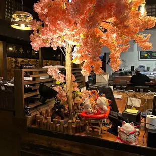 a fake tree in a restaurant
