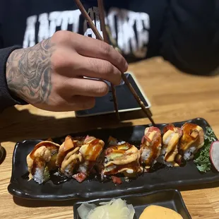 a man eating sushi
