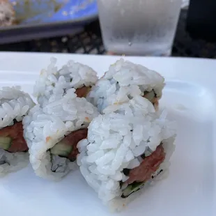 three pieces of sushi on a plate