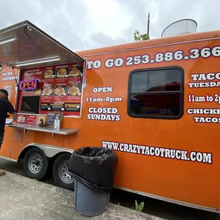 a man ordering food from a food truck