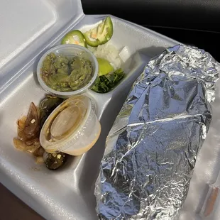 a taco in a styrofoam container