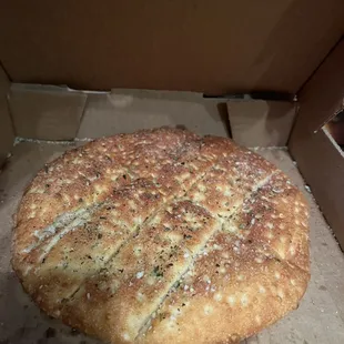 side garlic bread complimentary with pasta dish