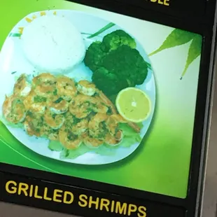 a plate of shrimp and broccoli