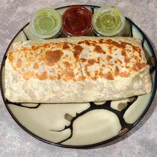 Mexican Sausage (chorizo) breakfast burrito onn a 8" plate. Big burrito!