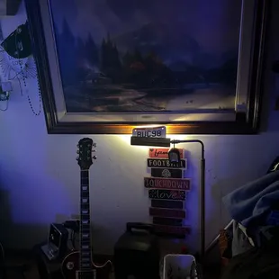 a guitar and a painting