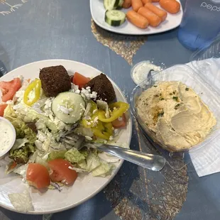 Hummus, veggies instead of pita and falafel on a Greek salad. YUM!!