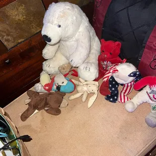 a stuffed polar bear and other stuffed animals