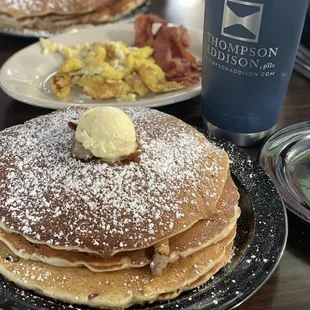 Full stack meat lover's stuffed pancakes. Side of scrambled eggs and bacon.