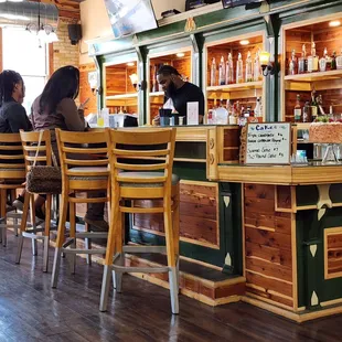 people sitting at the bar