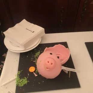 They were amused to have to use the little hammer Cream provided in order to get into the pig! :-)
