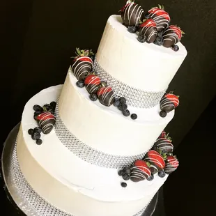 Wedding cake for a bride and groom who wanted to incorporate chocolate covered strawberries into their cake.