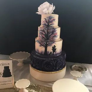 A unique and memorable wedding cake -- this cake featured a painted-on scene for a really dramatic and premium effect.