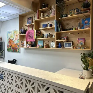 Cute set up while you wait in line, fun for kids to discover all the goodies on the shelf.