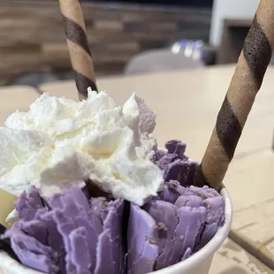 a cup of ice cream with whipped topping