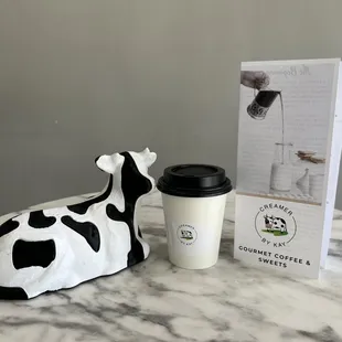 a cow and a cup of coffee