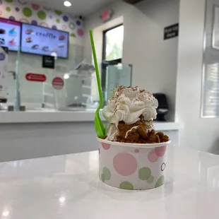 a cup of ice cream on a table