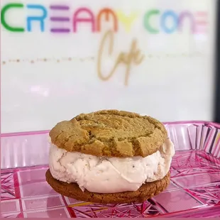 an ice cream sandwich on a pink tray