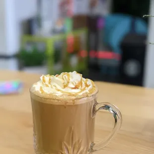 a cup of coffee with whipped cream